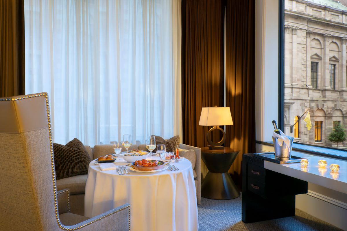 a table with food on it in a room with a window